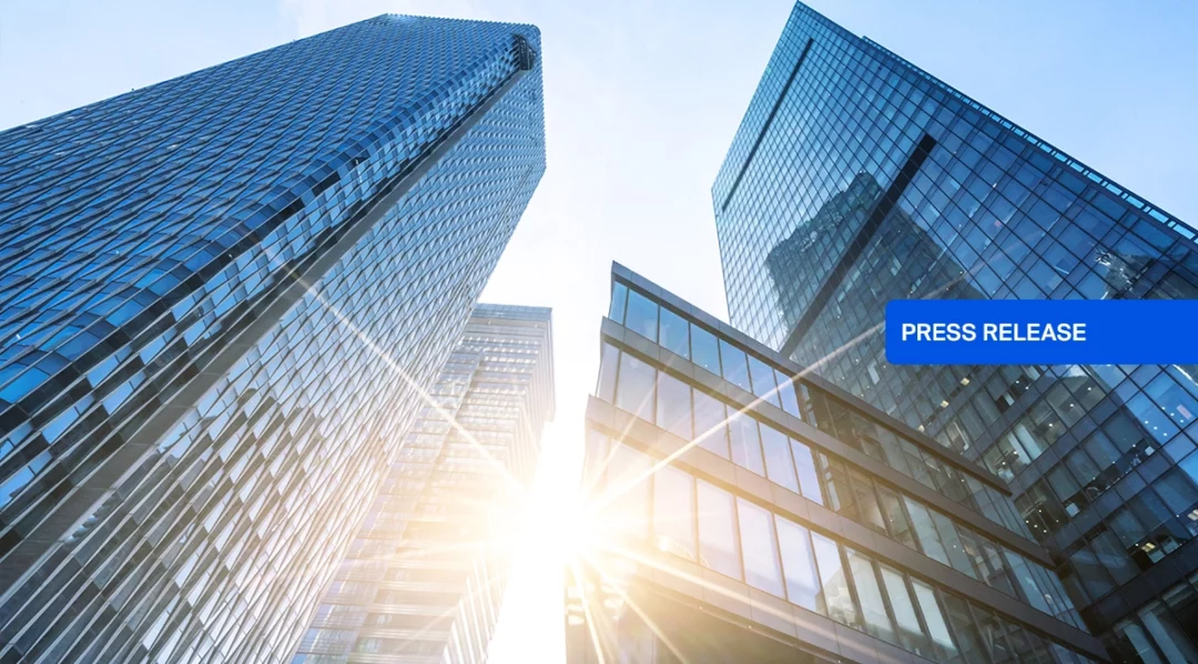 Modern skyscrapers with "Press Release" overlay, symbolizing Inspectorio's Series A funding.