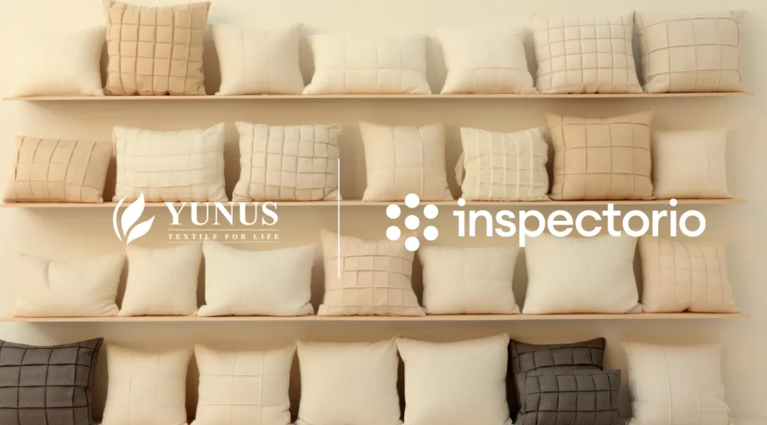 Yunus Textile Mills & Inspectorio logos on a shelf of pillows
