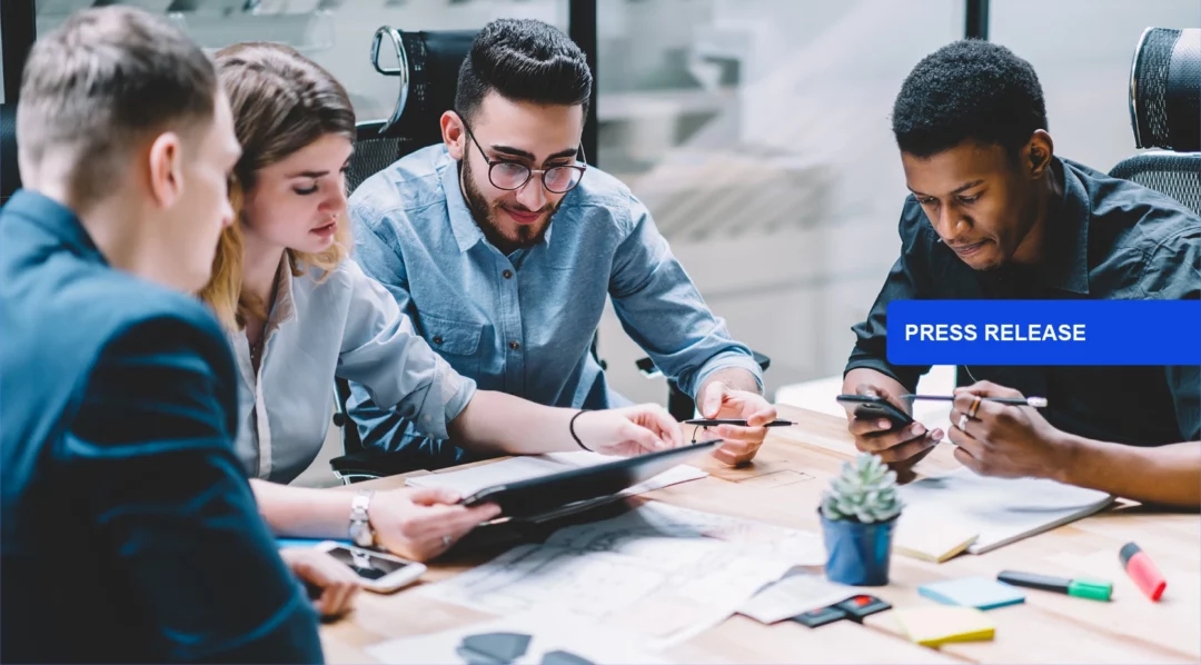 Team collaborating on a project, with a "Press Release" overlay.