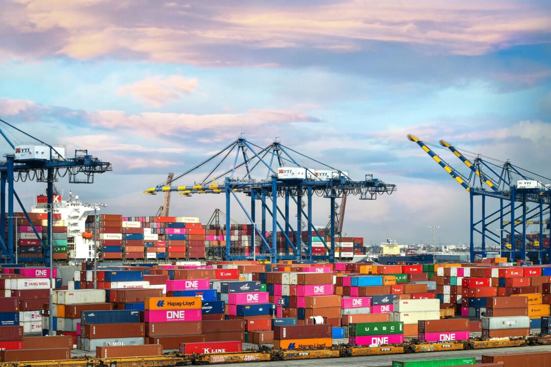 Shipping containers at a port, illustrating global trade and logistics.